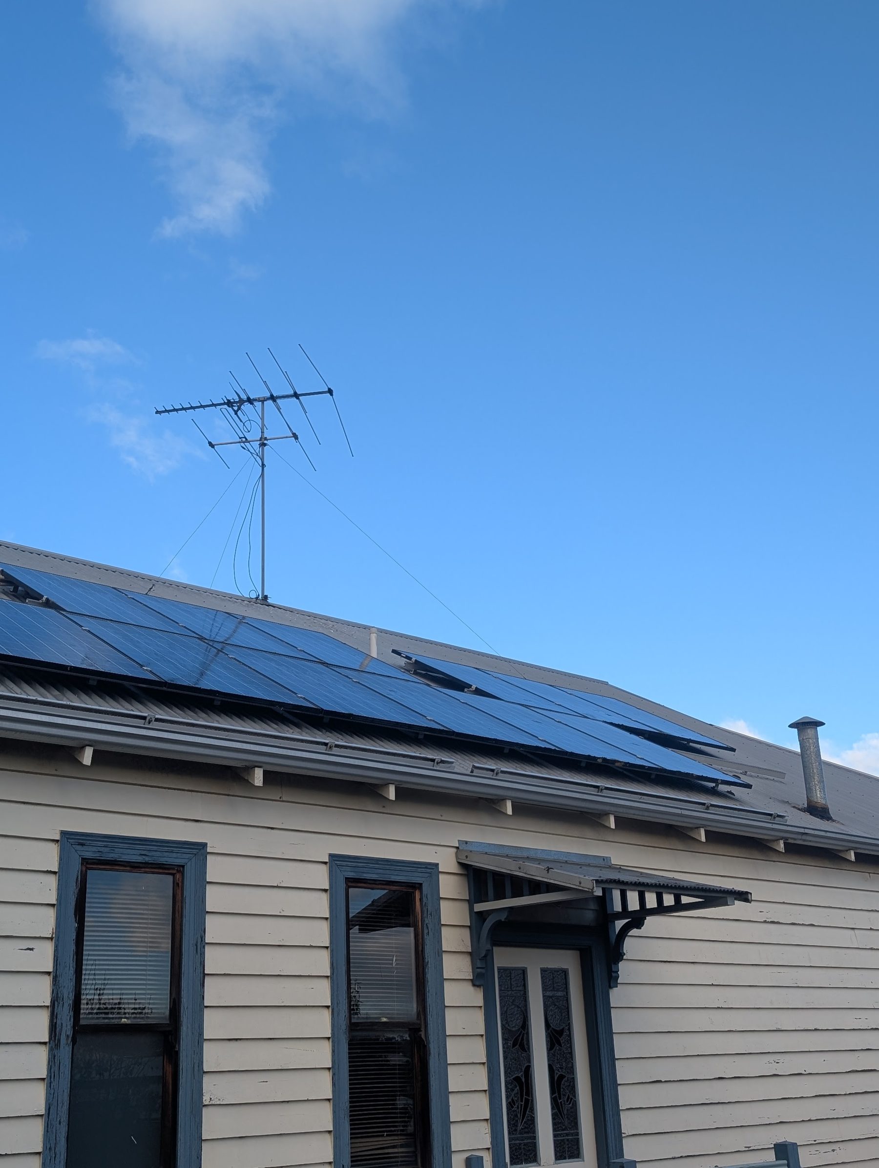 Solar panel detail — bird soiling — Heavy bird soiling lifted off a rooftop solar array with pure-water soft brush.