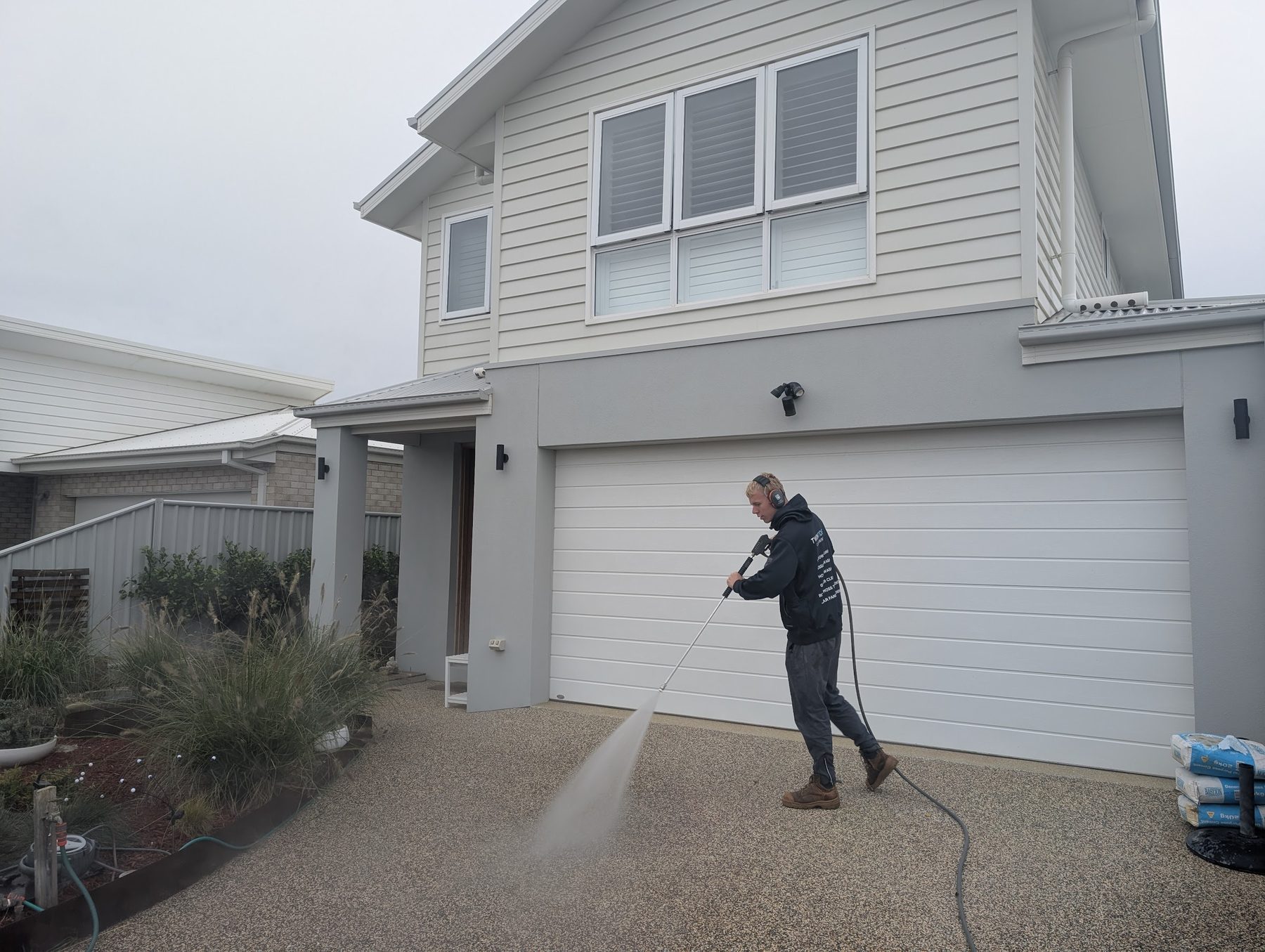 Pressure wash — patterned concrete drive — Years of grime and tyre marks lifted off a double-width driveway in a single visit.